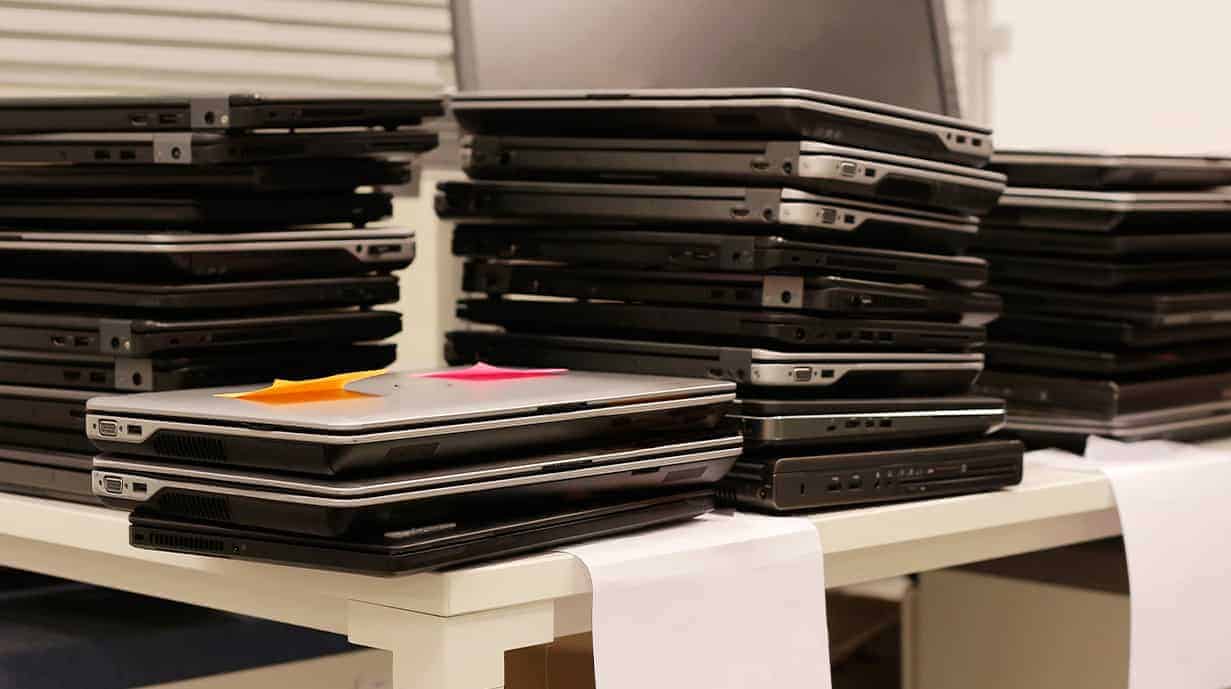 Image of stacked student laptops in an elementary school