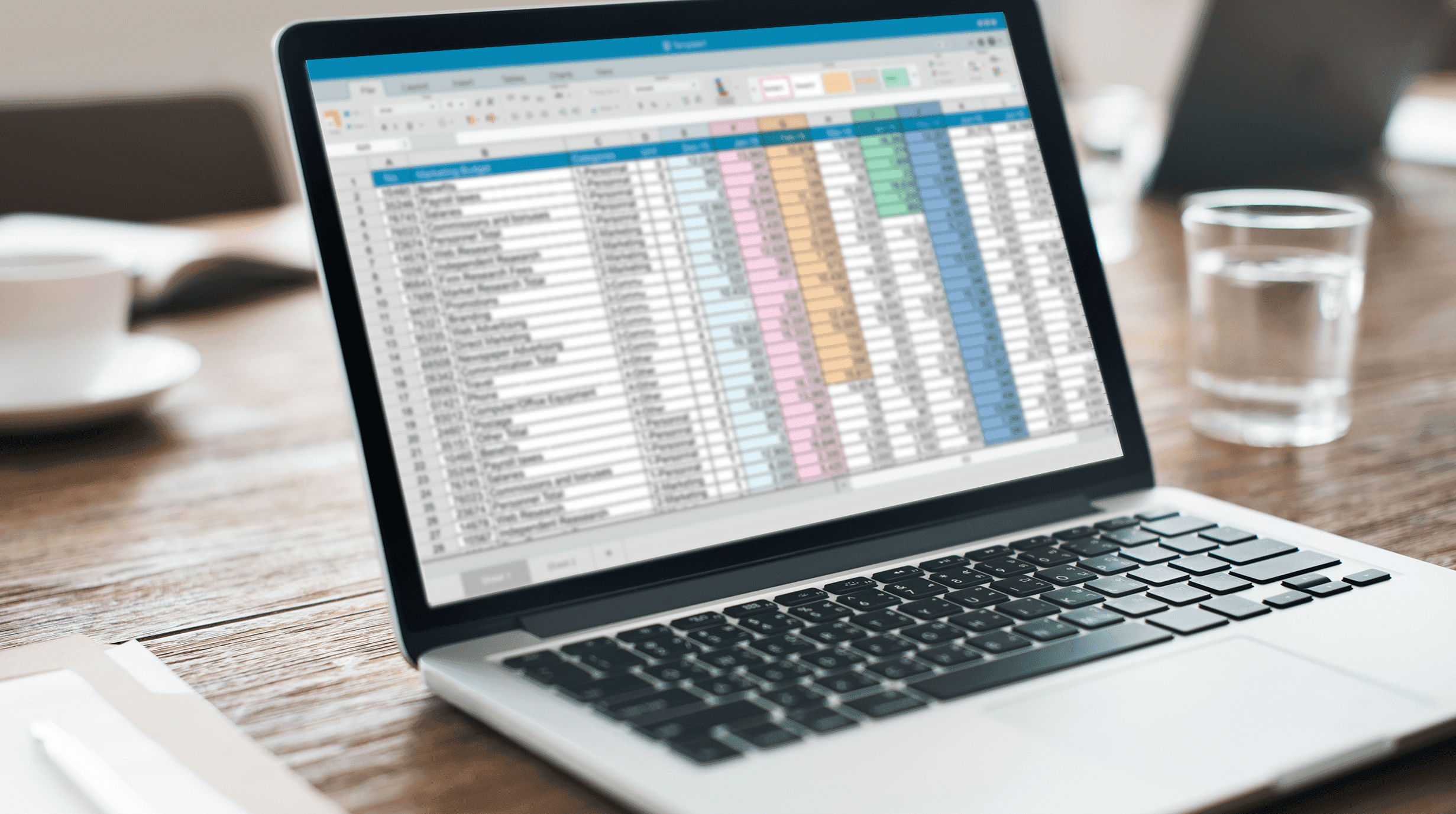 School IT asset inventory spreadsheet on laptop screen